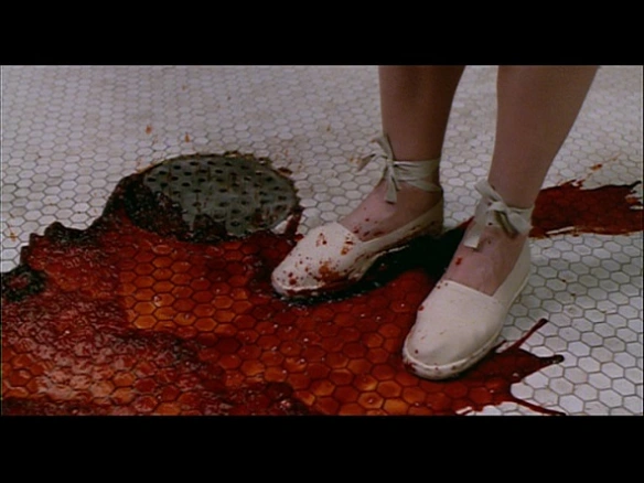 Irena stains her shoes with blood